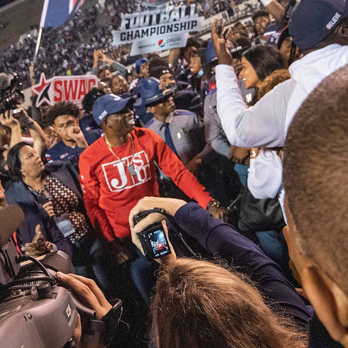 Jackson State head football coach Deion Sanders, center, and the JSU Tigers celebrate after JSU takes the SWAC Championship beating Prairie View A&M 27-10 at Veteran's Memorial Stadium in Jackson, Miss., Saturday, Dec. 4, 2021. Tcl Swac